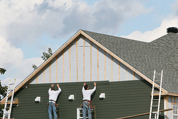 Professional Storm Damage Siding Repair technician working in Bethany, IL